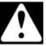 Manual del propietario de la lavadora de carga frontal Whirlpool - Icono de advertencia o precaución